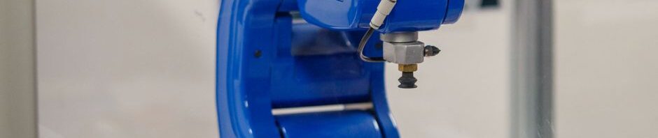 A robotic arm using advanced imaging technology to assemble components with precision on a production line.